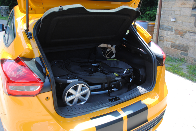 A stroller, car bag, and diaper bag fit. That dumb woofer should go, though. Photo: Author